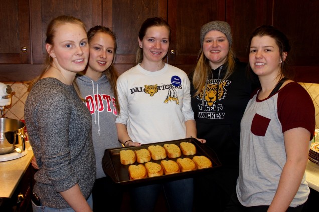 Dalhousie Women’s hockey team cooking a meal.