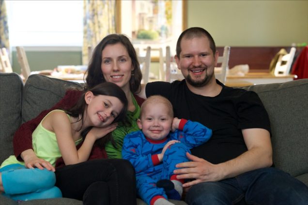 The Withey-Howse family on a couch.