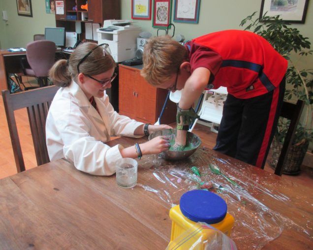 Teaching a child to have fun with science.